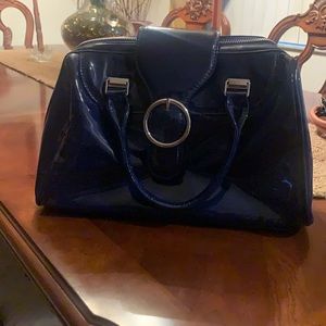 Blue faux leather charming Charlie bag . Clean inside and outside .